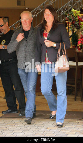 Neal McDonough holds hands with his wife after taking her for dinner at