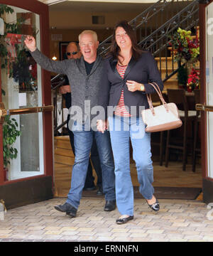 Neal McDonough holds hands with his wife after taking her for dinner at