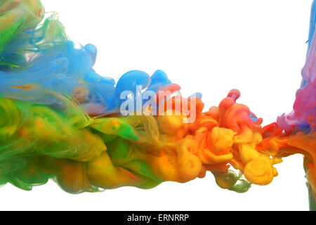 Clouds of bright colorful ink mixing in water Stock Photo