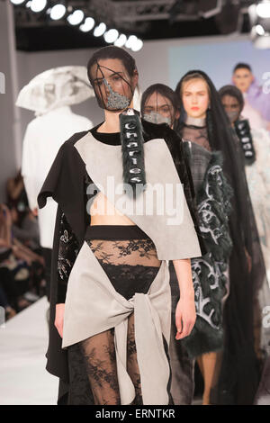 Models on the runway during the Ravensbourne fashion show at Graduate ...