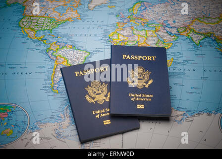 Passports on a map of the world with limited depth of field Stock Photo