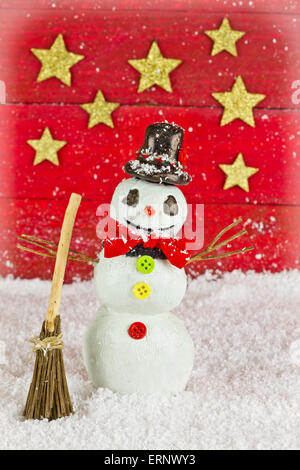 Snowman on red background with stars Stock Photo
