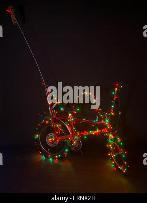 Original Raleigh Chopper Mark II decorated with Christmas lights. Stock Photo