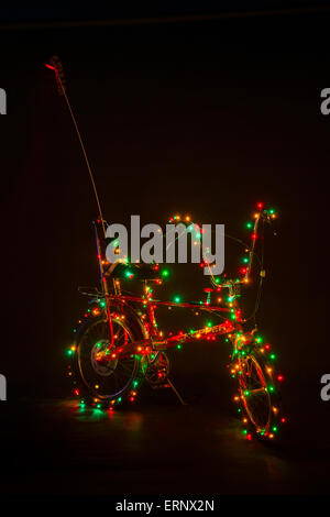 Original Raleigh Chopper Mark II decorated with Christmas lights. Stock Photo