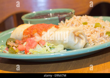 Chimichanga deep fried burrito with spanish rice and black beans Stock Photo