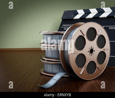 Cinema background with film reels and clapboard Stock Photo