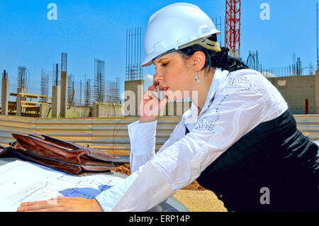 The architect specifies with the customer of a detail of drawings of construction of a new house Stock Photo