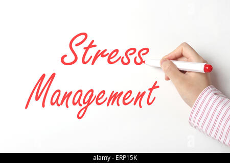 Business woman writing stress management word on whiteboard Stock Photo