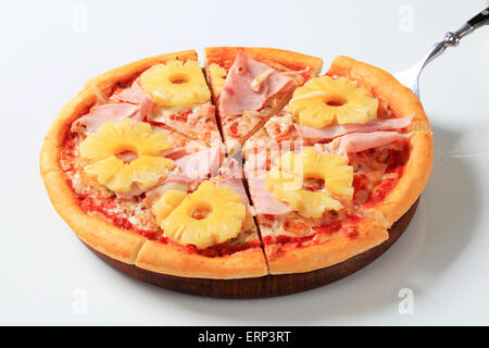 Pizza Hawaii cut into eighths Stock Photo