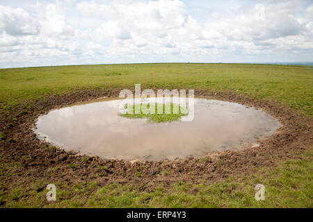 Dew pond water supply on the top of Tan Hill, All Cannings, Wiltshire, England, UK Stock Photo
