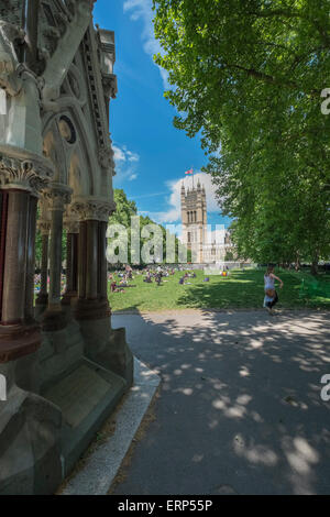 People relaxing on a sunny summers day in Victoria Tower Gardens, London UK Stock Photo