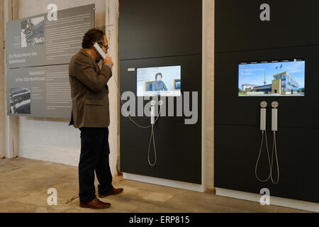 Alfeld, Germany. 06th June, 2015. A visitor stands in front of a screen in the new visitor centre of the UNESCO world heritage site Fagus Werk in Alfeld, Germany, 06 June 2015. The factory was designed by the world-famous architect and founder of the Bauhaus movement Walter Gropius and is known as a key work of the modern era. Photo: SWEN PFOERTNER/dpa/Alamy Live News Stock Photo