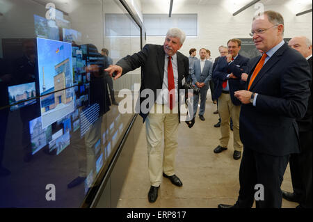 Alfeld, Germany. 06th June, 2015. Minister-President of Lower-Saxony Stephan Weil (SPD, r) and Exhibition Director of the new visitor centre, Karl Schuenemann, stand in front of a multimedia screen in the new visitor centre of the UNESCO world heritage site Fagus Werk in Alfeld, Germany, 06 June 2015. The factory was designed by the world-famous architect and founder of the Bauhaus movement Walter Gropius and is known as a key work of the modern era. Photo: SWEN PFOERTNER/dpa/Alamy Live News Stock Photo