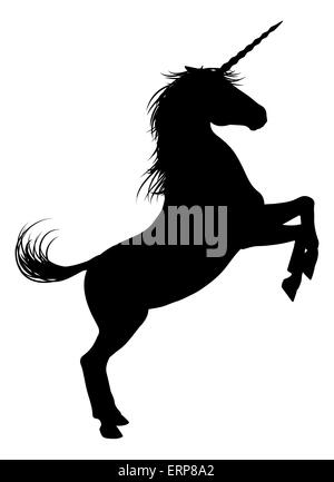 Unicorn mythical horse in silhouette rearing standing on hind legs Stock Photo