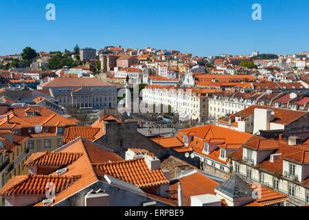 A view over the red rooftops of Lisbon city, the capital city of Portugal from the heights of the Funicular Elevador de Santa Ju Stock Photo