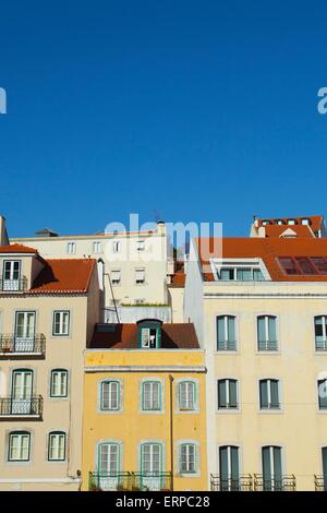 Colourful pombaline style buildings in Lisbon against a bright blue sky in summer Stock Photo