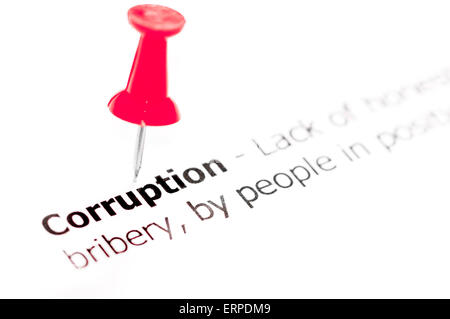 Word CORRUPTION pinned on white paper with red pushpin, available copy space. Business Concept Stock Photo