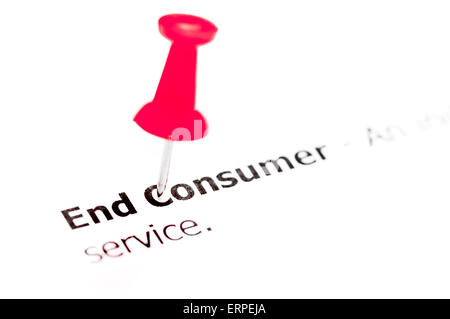 Words END CONSUMER pinned on white paper with red pushpin, available copy space. Business Concept Stock Photo