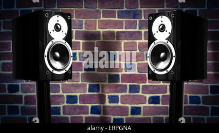 Black music speakers against brick wall background Stock Photo