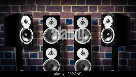 Black high gloss music speakers on brick wall Stock Photo