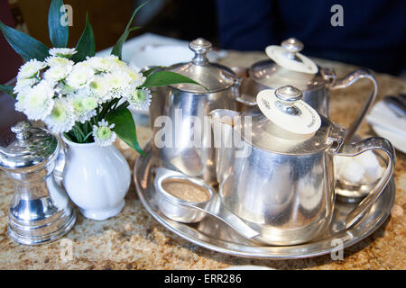 Tea silverware on a table (at Betty's Tea Room in York, England) Stock Photo