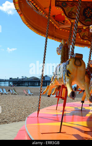 Victorian merry go round on Brighton beach. Stock Photo