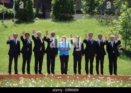 Elmau, Germany. 7th June, 2015. Participants of the G7 summit (L-R) President of the European Council Donald Tusk, Japanese Prime Minister Shinzo Abe, Canadian Prime Minister Stephen Harper, U.S. President Barack Obama, German Chancellor Angela Merkel, French President Francois Hollande, British Prime Minister David Cameron, Italian Prime Minister Matteo Renzi and European Commission President Jean-Claude Junker have a group photo taken at the Elmau Castle near Garmisch-Partenkirchen, southern Germany, on June 7, 2015. Germany hosts a G7 summit here on June 7 and J Stock Photo