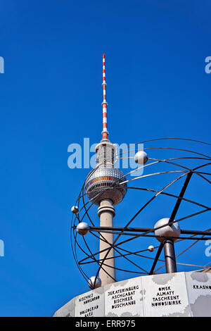 Germany, Berlin, Mitte district, Alexanderplatz, the World clock 'Urania' and television tower Fernsehturm. Stock Photo