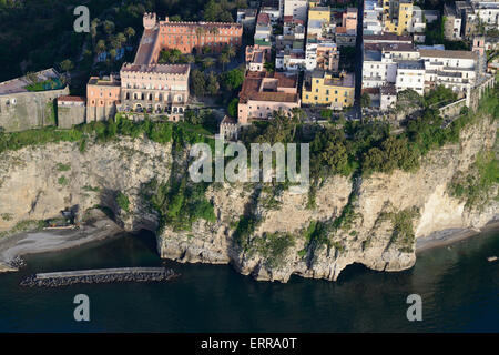 AERIAL VIEW. City on a clifftop overlooking the Mediterranean Sea. Vico Equense, Metropolitan City of Naples, Sorrentine Peninsula, Campania, Italy. Stock Photo