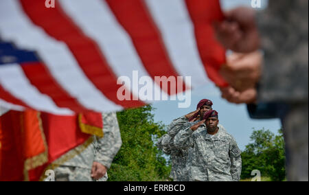 US Army 82nd Airborne paratroopers salute during a memorial ceremony to commemorate the 71st Anniversary of D-Day invasion June 7, 2015 in Sainte Mere Eglise, Normandy, France. Stock Photo