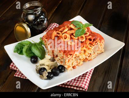 small rings of  Sicilian pasta with olive and capers tomatoes Stock Photo