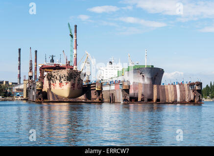 Two ships in major renovation in ship repair yard in Gdansk, Poland Stock Photo