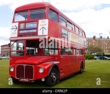 Iconic red AEC Routemaster double-decker buses parked on a street in ...