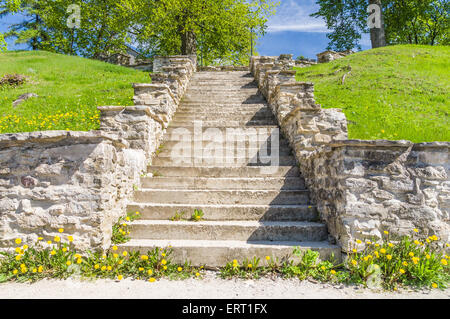 Medieval concrete stair in sunny springtime park Stock Photo