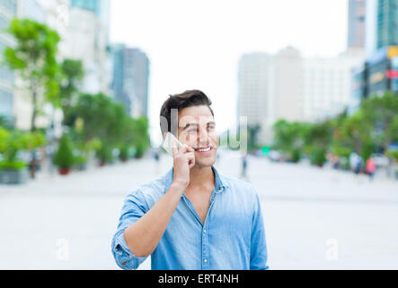Handsome man cell phone call smile outdoor city street Stock Photo