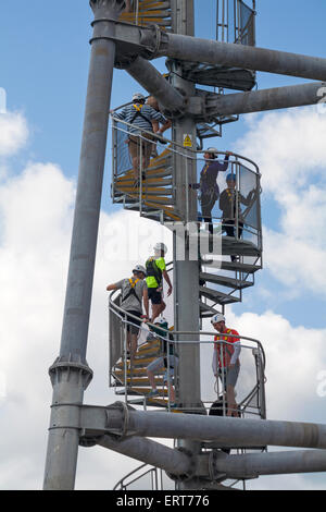 Climbing up spiral staircase to the top of the launch tower to try out the pier zipwire on Bournemouth Pier, Dorset in June Stock Photo