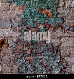 Paint peeling on an old mill wall which has been neglected over the years Stock Photo