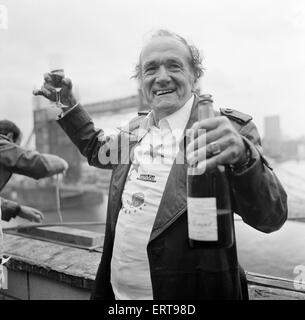 Karl Wallenda, Tightrope Walker, crosses 100ft above the ground, near Tower Bridge, London, Monday 22nd November 1976. Pictured celebrating after crossing. Stock Photo