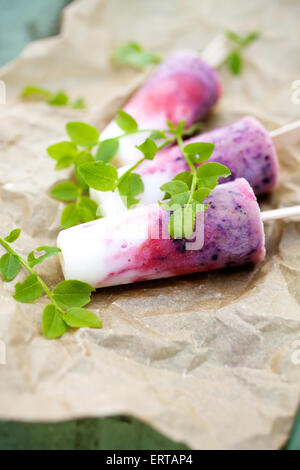 Popsicle with yogurt, blueberries and strawberries Stock Photo