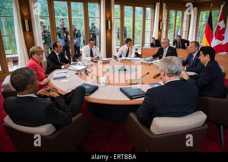 World leaders meet during the second day of meetings at the G7 Summit meeting June 8, 2015 in Schloss Elmau, Germany. Sitting (L to R):  German Chancellor Angela Merkel, French President Francois Hollande, British Prime Minister David Cameron, Italian Prime Minister Matteo Renzi, European Commission President Jean-Claude Juncker, European Council President Donald Tusk, Japanese Prime Minister Shinzo Abe, Canadian Prime Minister Stephen Harper and United States President Barack Obama. Stock Photo