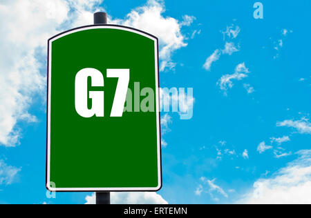 G7 SUMMIT written on green road sign  against clear blue sky background. Concept image with available copy space Stock Photo