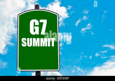 G7 SUMMIT written on green road sign  against clear blue sky background. Concept image with available copy space Stock Photo