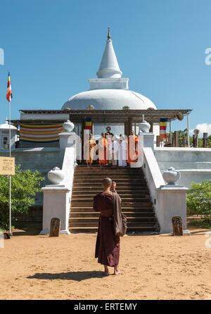 Monks Visiting Lankaramaya Dagoba (Lankarama Stupa), Anuradhapura, Sri Lanka Stock Photo