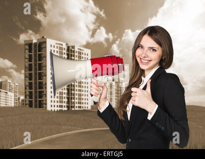 Woman speaking in megaphon Stock Photo