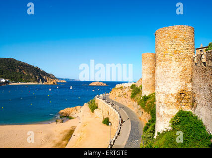 a view of the Platja Gran beach and the walls of the Vila Vella, the old town, of Tossa de Mar, Spain Stock Photo