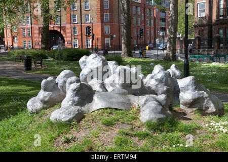 Silver Clouds sculpture by Robert Worley in Goldington Crescent Gardens, Camden, London, England (2010, cast aluminum) Stock Photo