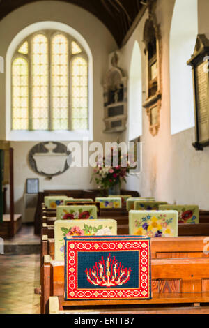 Prayer or kneeling cushion in a pretty English village church, England, UK Stock Photo