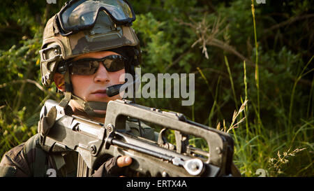 A French soldier with the Foreign Legion’s 6th Light Armored Brigade during a bilateral seize and capture training exercise with U.S. Marine commandos May 29, 2015 in Quartier Colonel de Chabrieres, France. Stock Photo