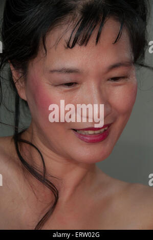 Face of mature beautiful Asian woman with eyes closed Stock Photo - Alamy