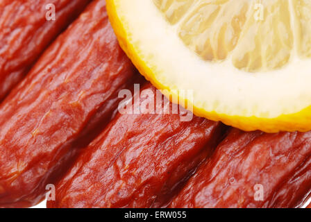 Group of tasty sausages with lemon Stock Photo